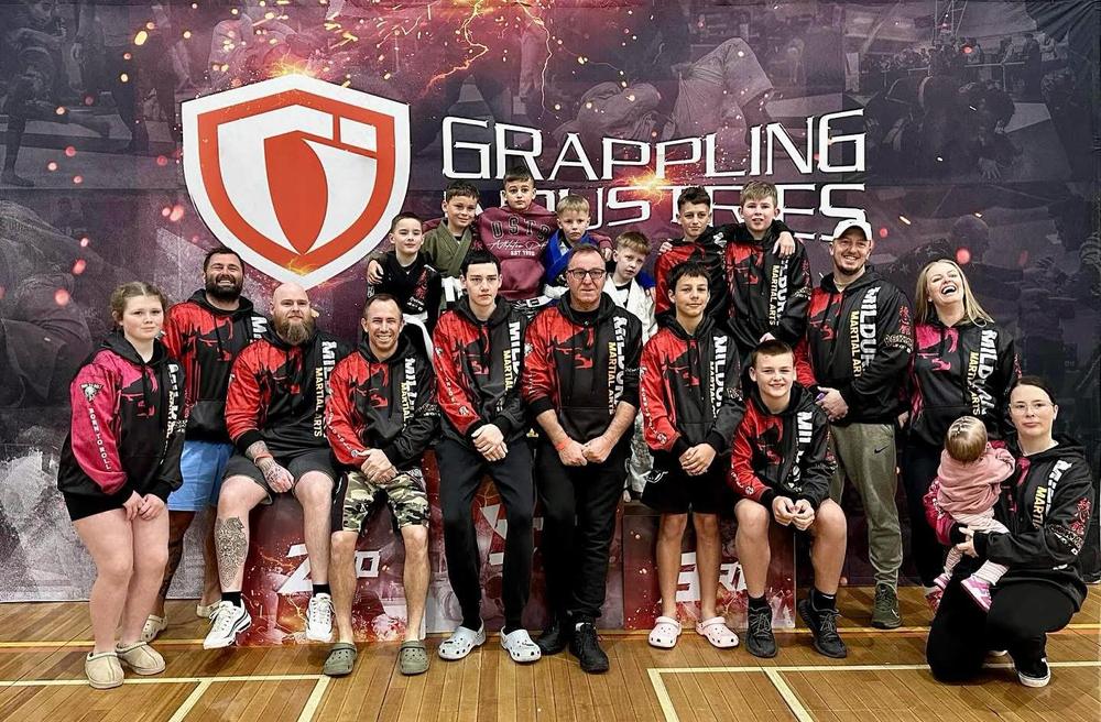The Mildura Martial Arts team in club hoodies at a Grappling Industries tournament